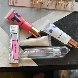 r.e.m beauty wicked glinda lip oil + other assorted lip glosses (Ariana Grande)